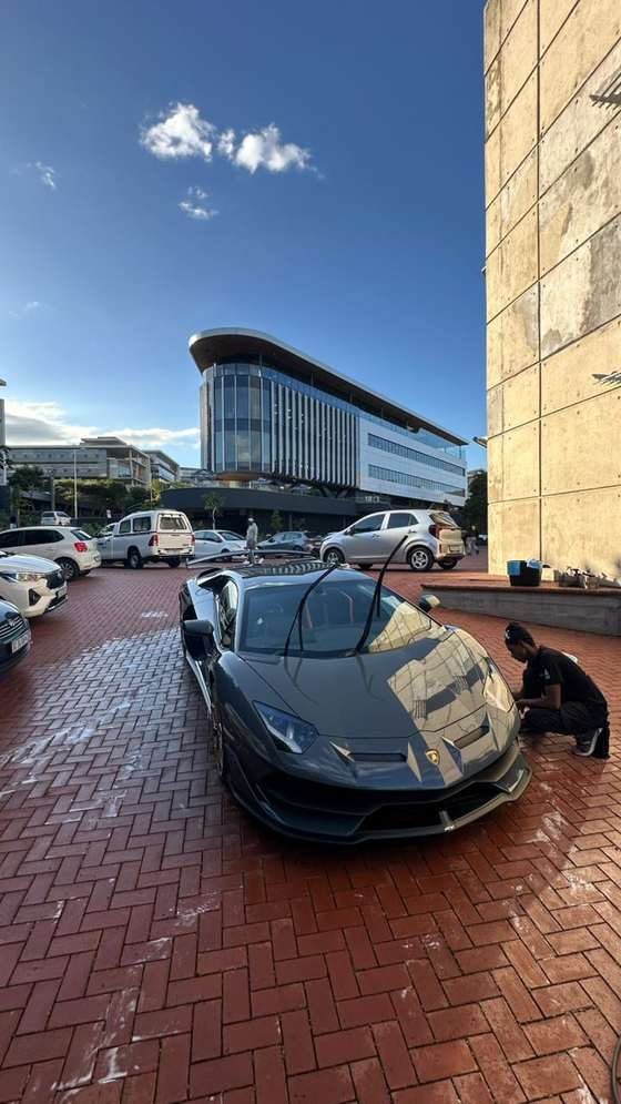 Washr detailer hand-washing a Lamborghini Aventador SVJ in KZN